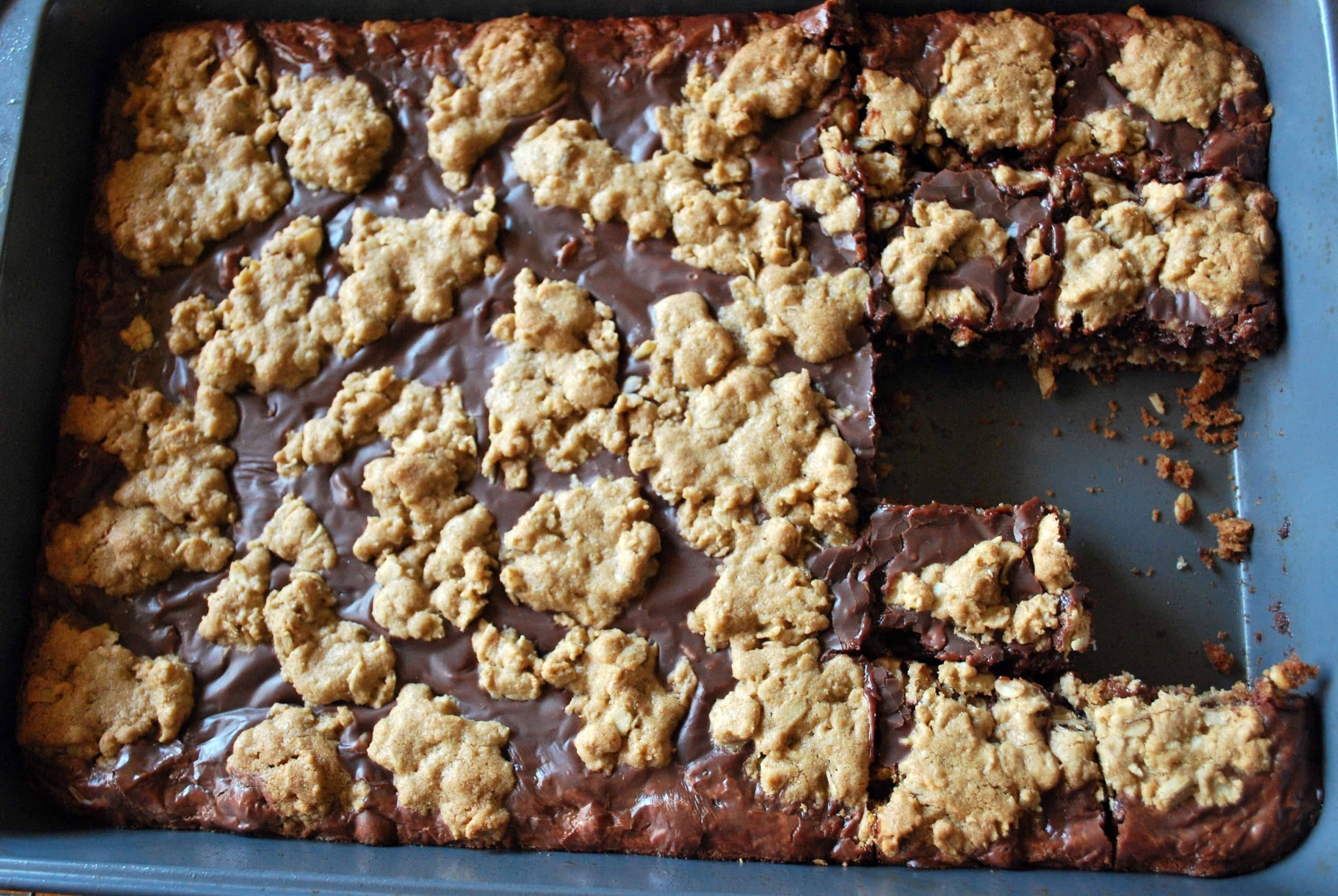 ChocolateOatBarsPan Chocolate Oat Bars in a sheet pan with a few slices missing