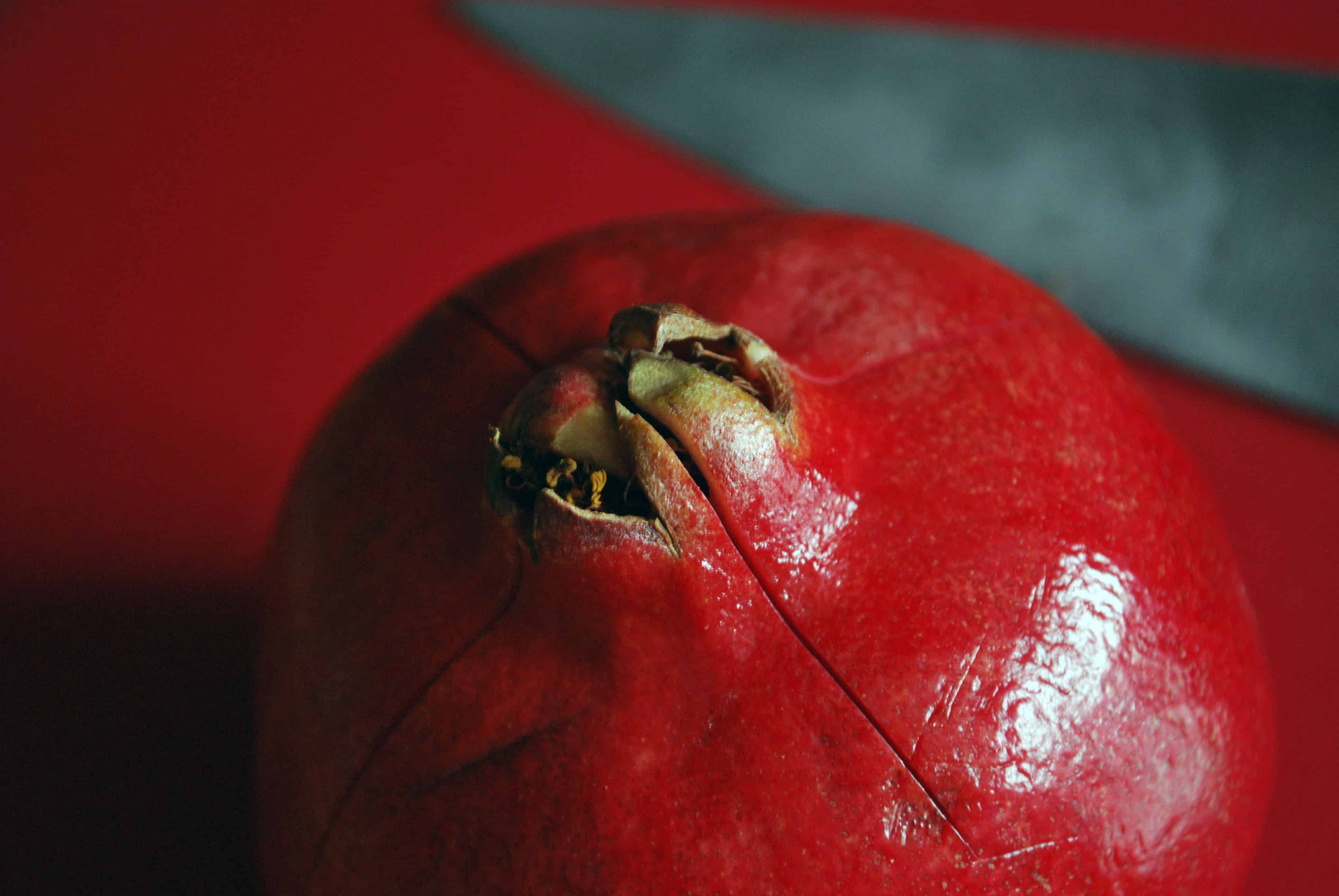PomegranateScore Pomegranate with four slits in the top