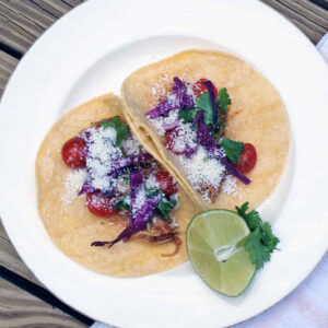 slow cooker pork tacos on a plate