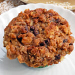 a banana oat muffin on a white plate