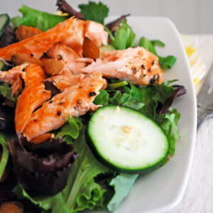 salmon salad on a white square plate