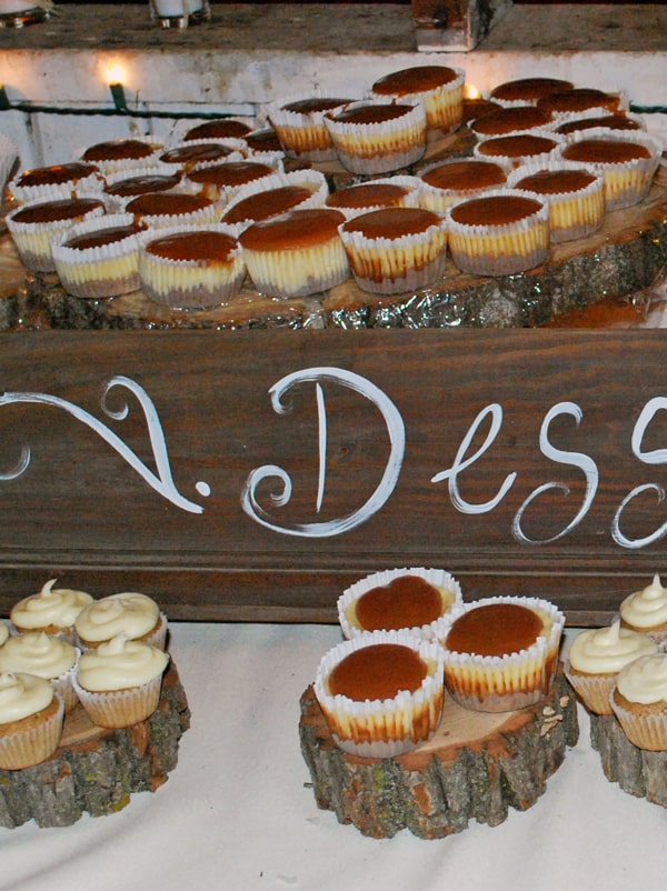 Cheesecake Cupcakes with Caramel Topping on a dessert table.