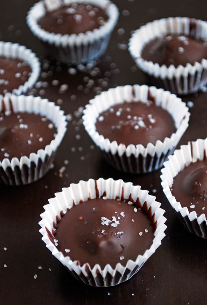several dark chocolate almond butter cups