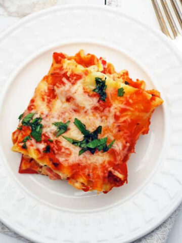 a lasagna roll on a white plate