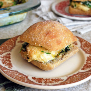 a baked egg sandwich on a plate