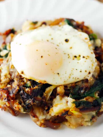 cheesy vegetarian hash topped with an egg