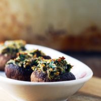 a tray of spinach stuffed mushrooms