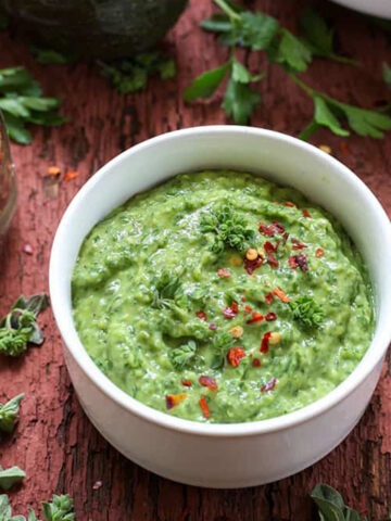 a small bowl of avocado chimichurri dip