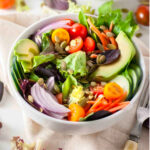 two white bowls of the best vegan salad.