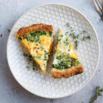 two slices of sweet potato and spinach quiche on a plate