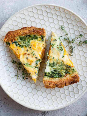 two slices of sweet potato and spinach quiche on a plate