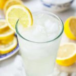 single serving lemonade in a glass with lemons