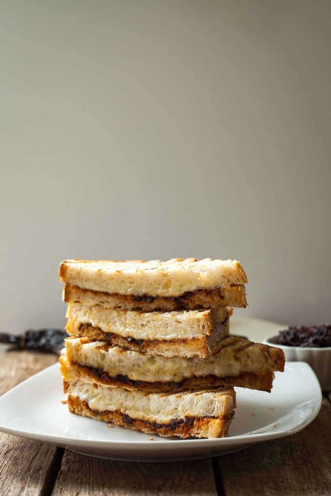 a stack of halved harissa grilled cheese sandwiches