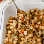 simple vegetarian stuffing in a dish with a spoon sticking out