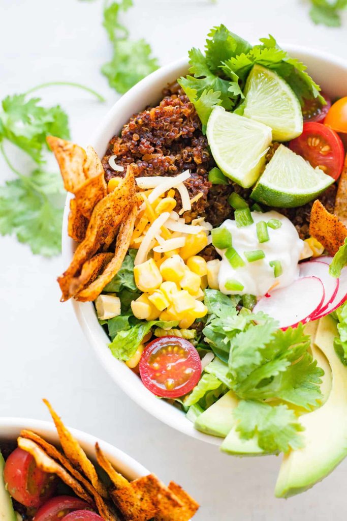 Quinoa Taco Salad - This is the tastiest way to eat all the veggies! This vegetarian bowl is given a spicy kick with the addition of quinoa taco meat! Recipe at theliveinkitchen.com