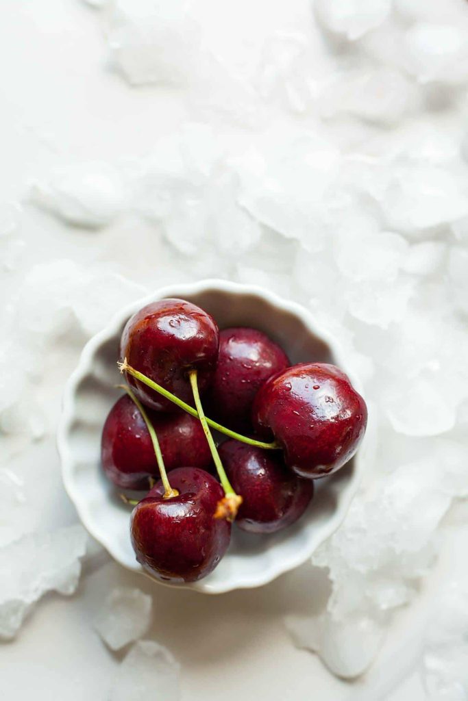 Cherry Froyo Popsicles - These frozen treats are healthy though to enjoy for breakfast! Frozen yogurt popsicles naturally sweetened with fruit and honey. My kids love these! Full recipe at theliveinkitchen.com