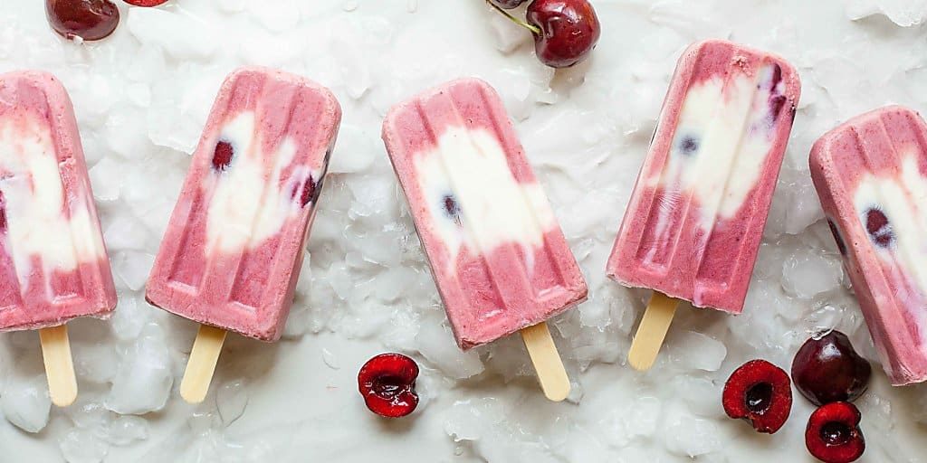 Cherry Froyo Popsicles - These frozen treats are healthy though to enjoy for breakfast! Frozen yogurt popsicles naturally sweetened with fruit and honey. My kids love these! Full recipe at theliveinkitchen.com