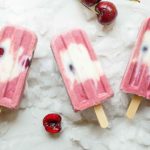 Cherry Froyo Popsicles - These frozen treats are healthy though to enjoy for breakfast! Frozen yogurt popsicles naturally sweetened with fruit and honey. My kids love these! Full recipe at theliveinkitchen.com