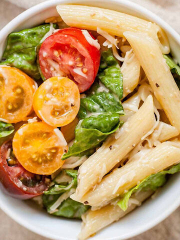caesar pasta salad in a white bowl