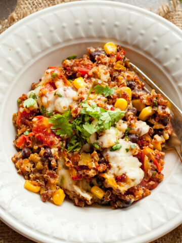 crispy quinoa bake in a bowl with a fork