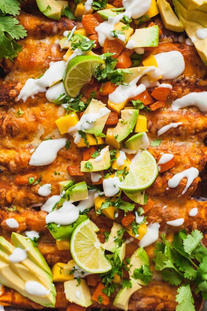 close up photo of vegetarian enchiladas with all the toppings