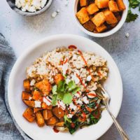 overhead photo of a sweet potato buddha bowl with a bowl of sweet potato chunks