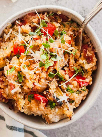 image of quinoa casserole in small bowl with utensil inside.