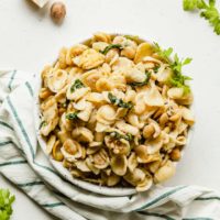 Orecchiette with Spinach and Butter Beans - A fast and easy vegetarian dinner idea that's perfect for weeknights! #easydinner #dinnerideas #vegetarian #vegetariandinnerideas #pasta