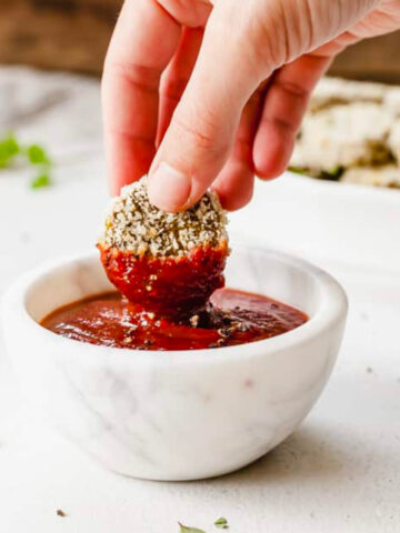 Homemade veggie nugget dipped into sriracha ketchup.