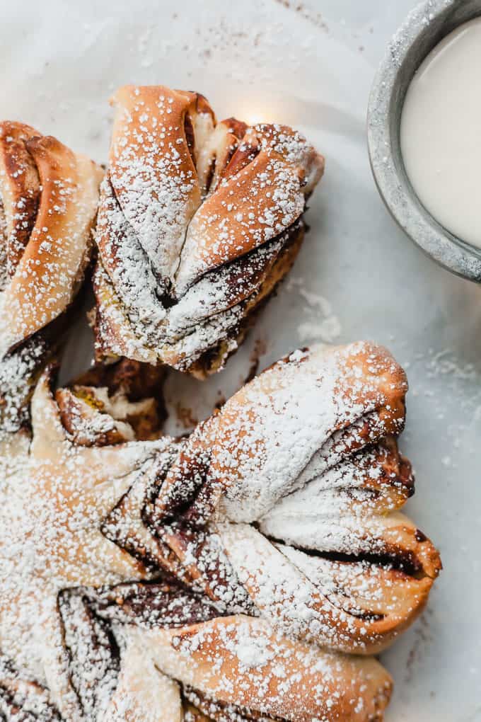 chocolate pistachio christmas star bread with one piece broken off