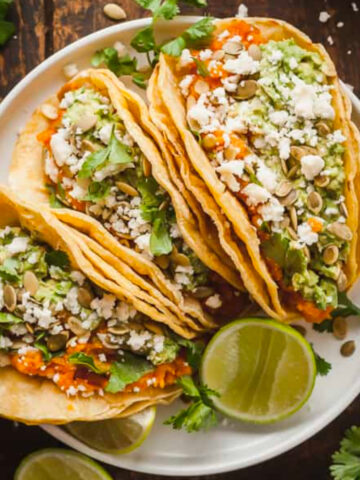 three sweet potato tacos on a plate.