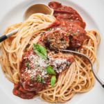 eggplant meatballs on a plate of spaghetti