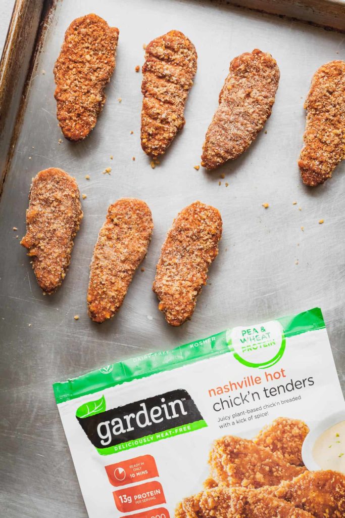Gardein meatless tenders on a baking sheet with the package