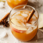 apple cider cocktail with a cinnamon stick
