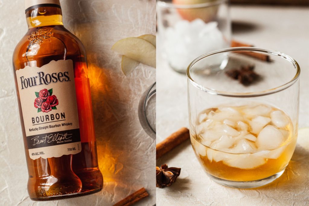 a bottle of whiskey and some in a glass with ice