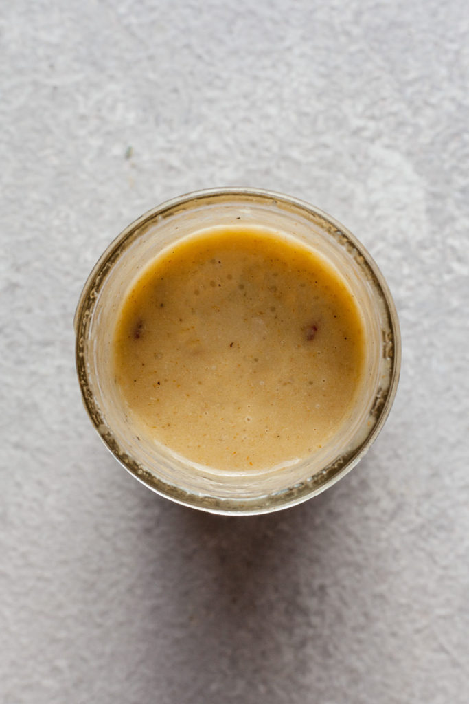 lemon tahini dressing in a mason jar