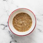 a flax egg in a white bowl