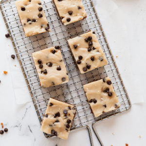 a cooling rack with six cookie dough bars