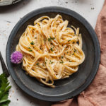 fettuccine alfredo on black plate