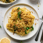 featured image of angel hair noodles with arugula and pistachio