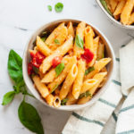 featured image of tomato and feta pasta in bowl from top