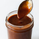 featured image of chipotle enchilada sauce in mason jar with spoon