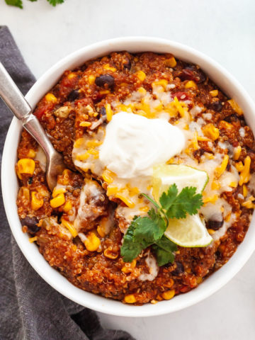 featured image of quinoa enchilada in white bowl with fork inside