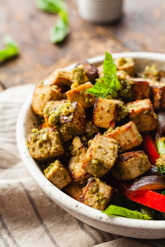a bowl of pesto tofu with veggies
