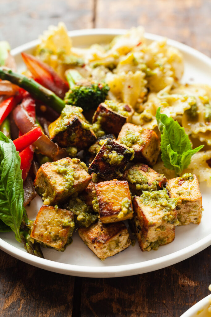 a bowl of pesto tofu with balsamic veggies