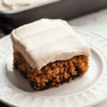 a slice of frosted oatmeal cake