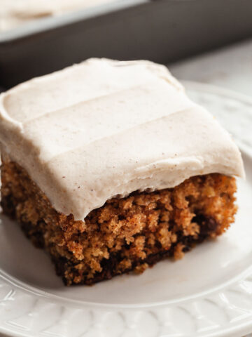 a slice of frosted oatmeal cake