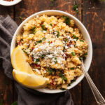 a bowl of mediterranean couscous salad