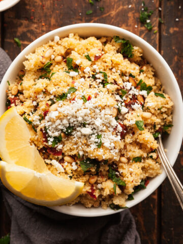 a bowl of mediterranean couscous salad