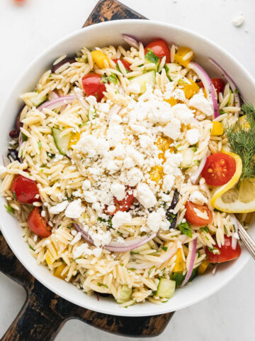 a bowl of greek orzo salad